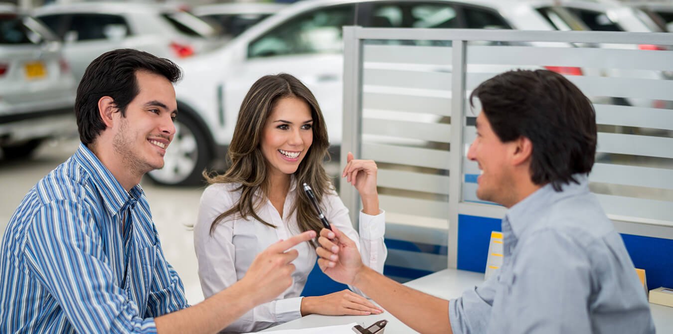 car dealer giving keys