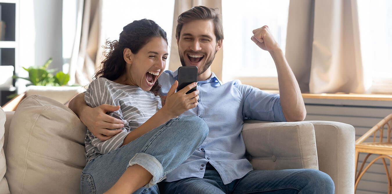 happy couple on couch