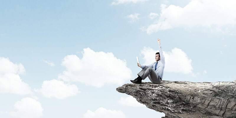 happy man on mountain edge