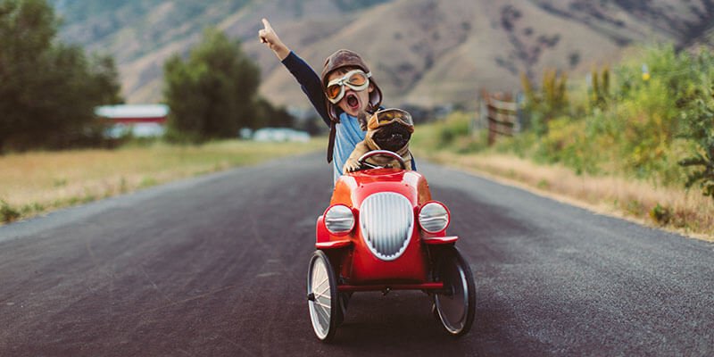 kid speeding in toy car